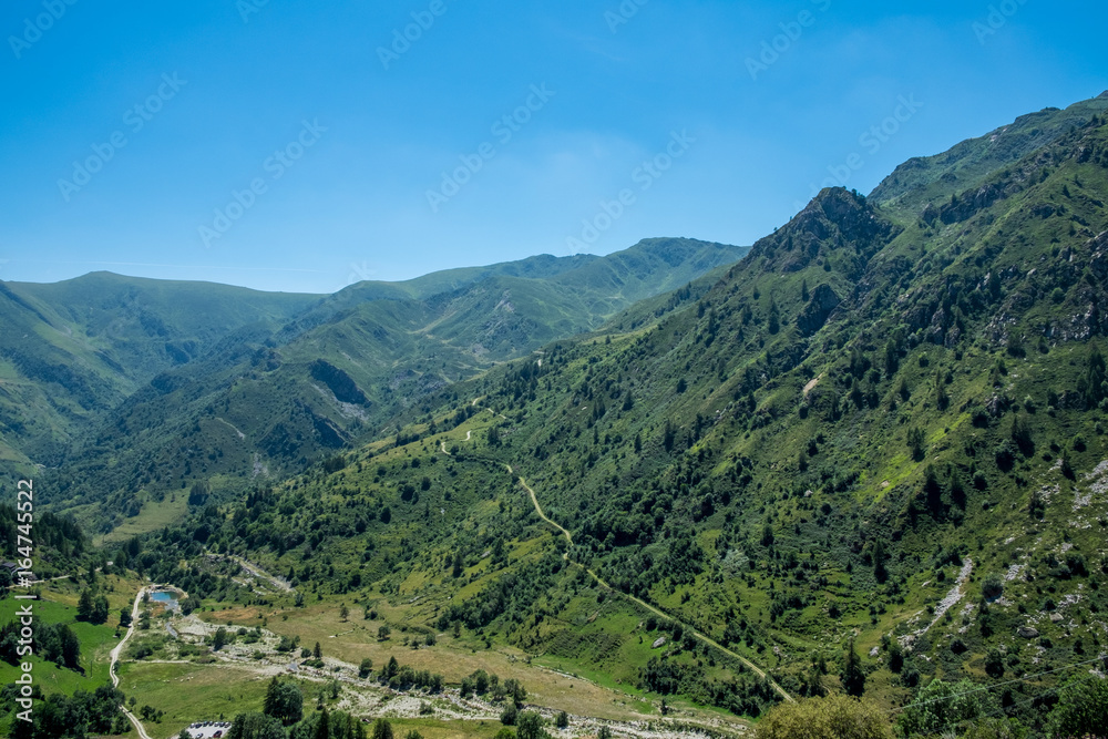 Mountain peaks meadows and forests in Grana Valley, Cuneo, Piedmont, Italy.