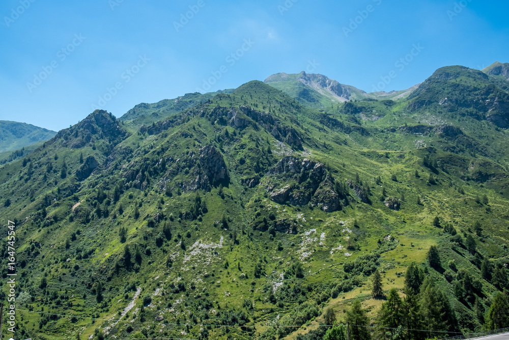 Mountain peaks meadows and forests in Grana Valley, Cuneo, Piedmont, Italy.