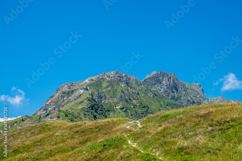 Mountain peaks and meadows in Grana Valley, Cuneo, Piedmont, Italy.