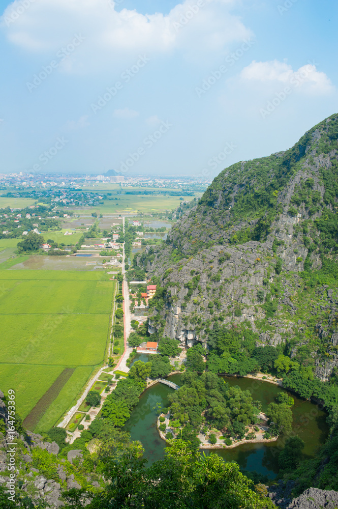 Limestone Landscape with Rice Paddies and view onto Villages and Ninh Binh, Mua Caves Viewpoint, Tam Coc, Vietnam