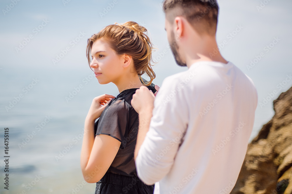 Beautiful Couple At Beach.Outdoor portrait happy beautiful couple,couple having fun by sea,enjoy vacation,trendy hipster look,happiness,love,summer holidays,man touching girlfriend,tan Beautiful Couple At Beach.Outdoor portrait happy beautiful couple,couple having fun by sea,enjoy vacation,trendy hipster look,happiness,love,summer holidays,man touching girlfriend,tan