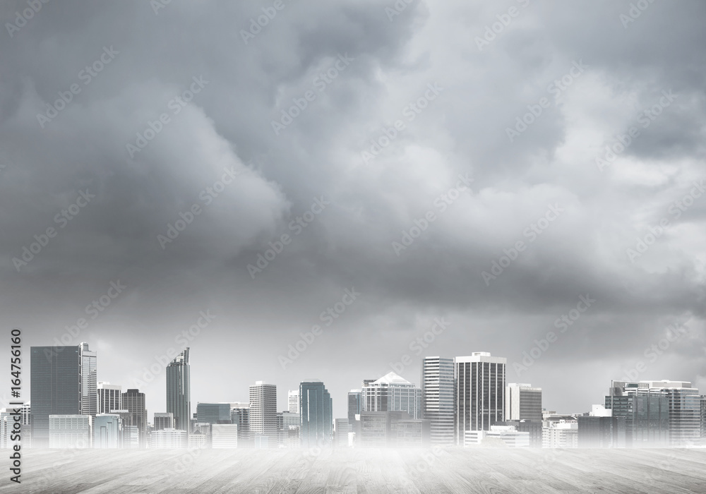 Fototapeta premium Modern urban buildings skyscrapers blue cloudy sky background and wooden textured platform
