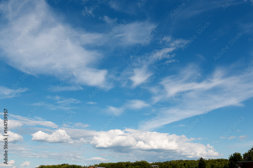 White fluffy big clouds against blue sky White fluffy big clouds against blue sky