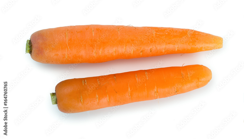 Pair of fresh, ripe carrots isolated on white background, top view. Pair of fresh, ripe carrots isolated on white background, top view.