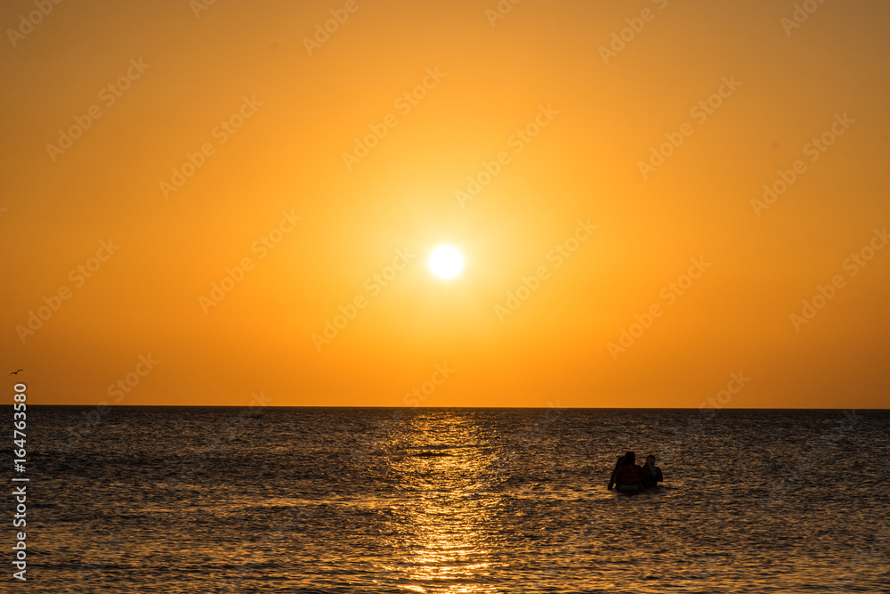 People on Beach during Sunset 