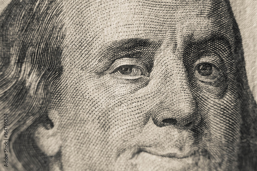 Winking Benjamin Franklin on hundred US dollars bill