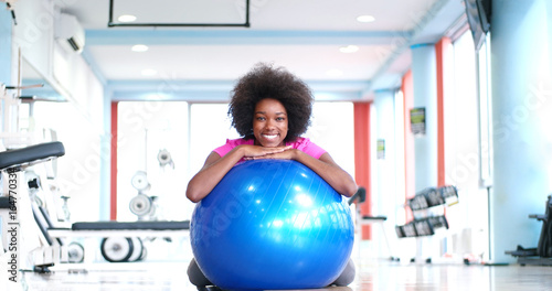portrait of young afro american woman in gym on workout break