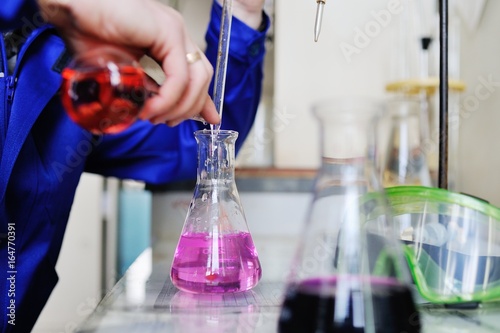 Laboratory scientist working at lab with test tubes