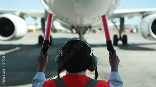 Worker guiding plane on runway