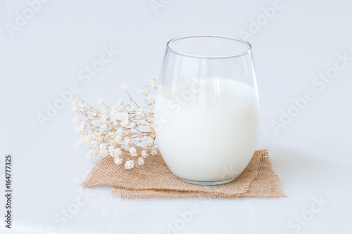 Fresh milk in a glass on marble table.