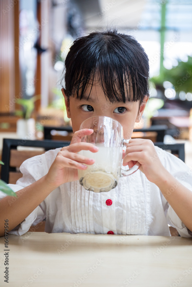 Asian Chinese little girl drinking beverage Asian Chinese little girl drinking beverage