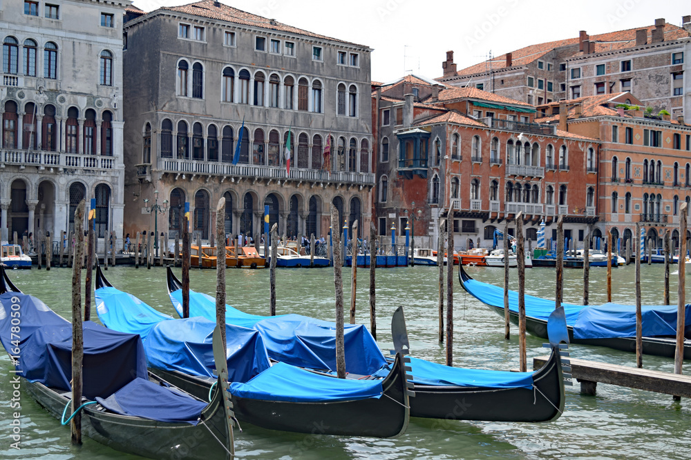 Gondolas docked near Santa Maria train station, on the Grand Canal in Venice, Italy