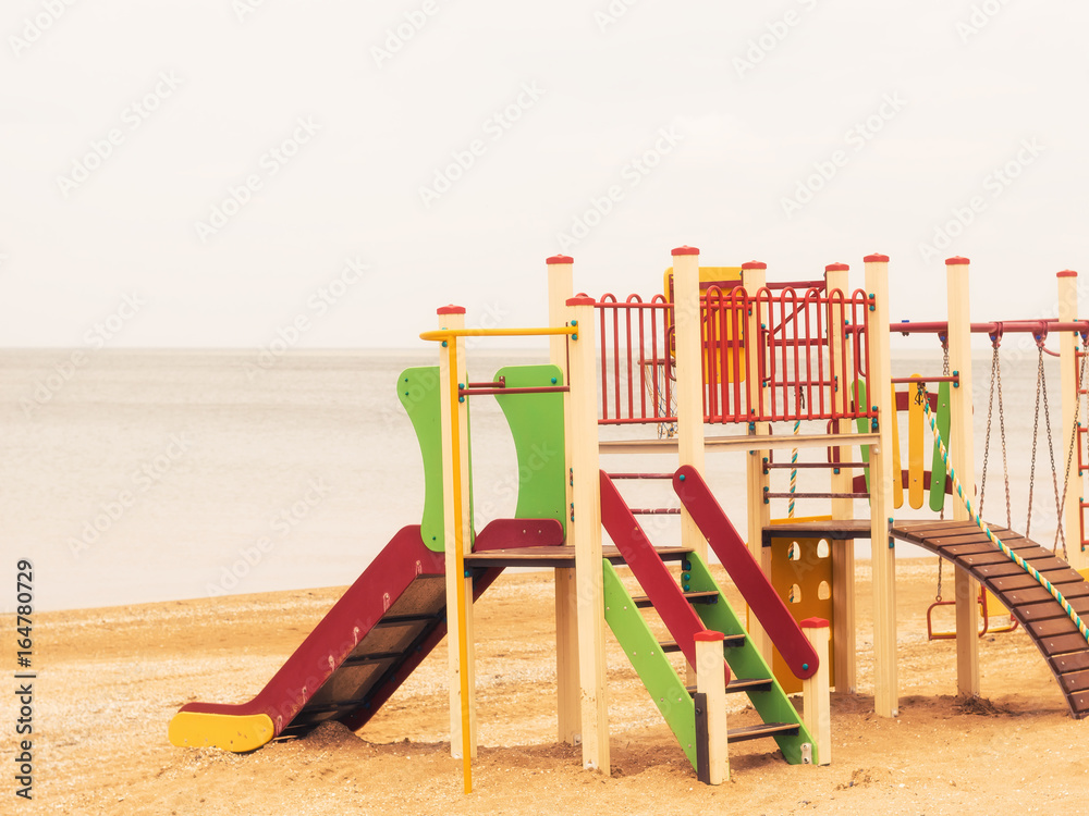 Children's complex on the sandy beach by the sea. Children's complex on the sandy beach by the sea.