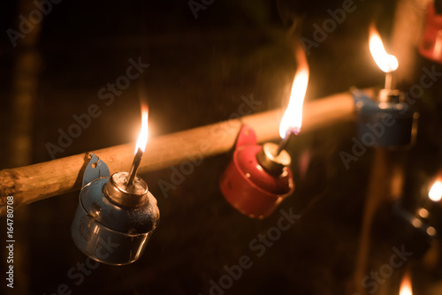 Malay tradition oil lamp or pelita selective focus and Bokeh during Hari Raya celebration photo
