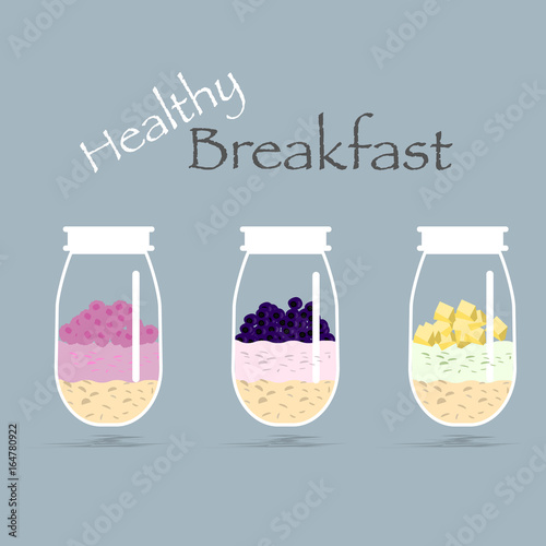 Healthy breakfast in a jar. Oatmeal, yogurt, fruits and berries 