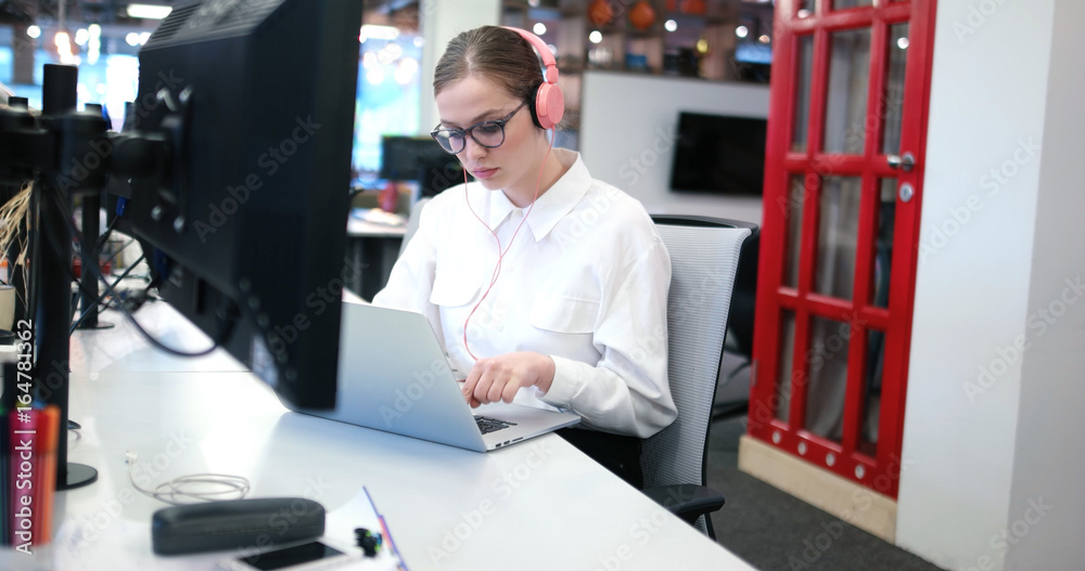 businesswoman using a laptop in startup office businesswoman using a laptop in startup office