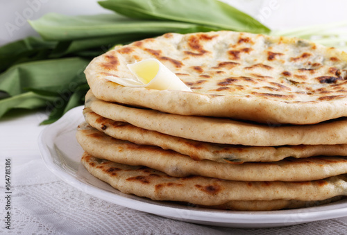 Khychiny – traditional caucasian flatbread filled with сheese and herbs.