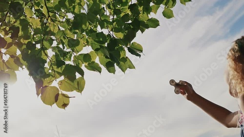 A young bright girl shows a spinner. photo