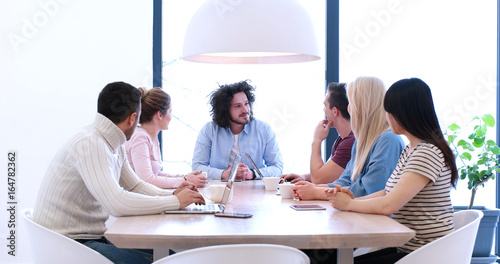 Startup Business Team At A Meeting at modern office building