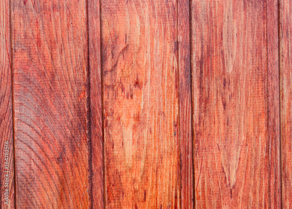 Abstract background of wooden boards covered with a dark orange varnish Abstract background of wooden boards covered with a dark orange varnish