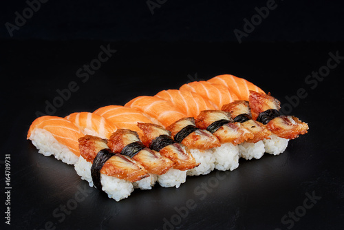 Sushi on black background. Perfect for creating sushi restaurant menu. Part of series.