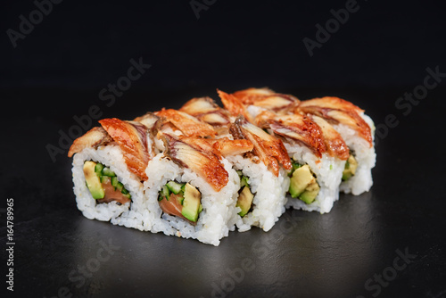 Sushi on black background. Perfect for creating sushi restaurant menu. Part of series.