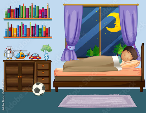 Boy sleeping in bedroom at night