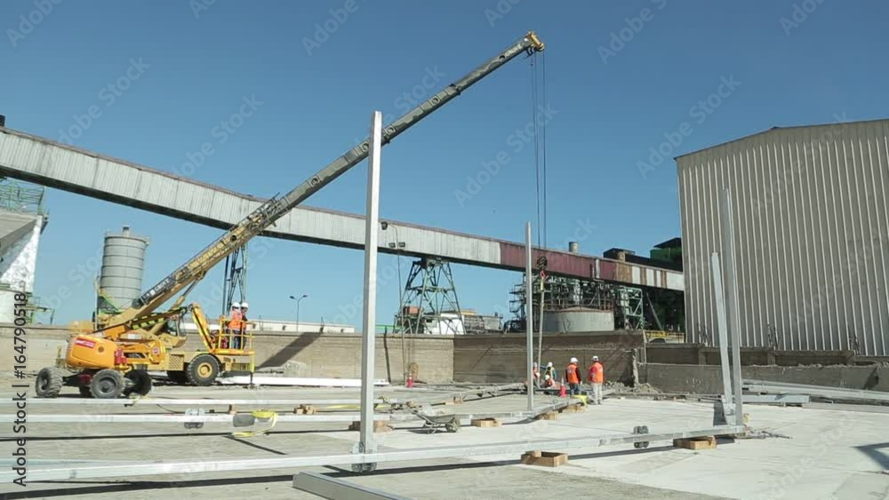 Construction crane carries workers Construction crane carries workers