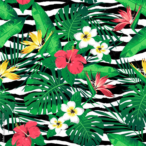 Tropical flowers and leaves on zebra striped background. Seamless. Vector.