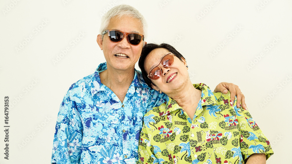 Happy Asain senior couple ready to travel for holiday Happy Asain senior couple ready to travel for holiday