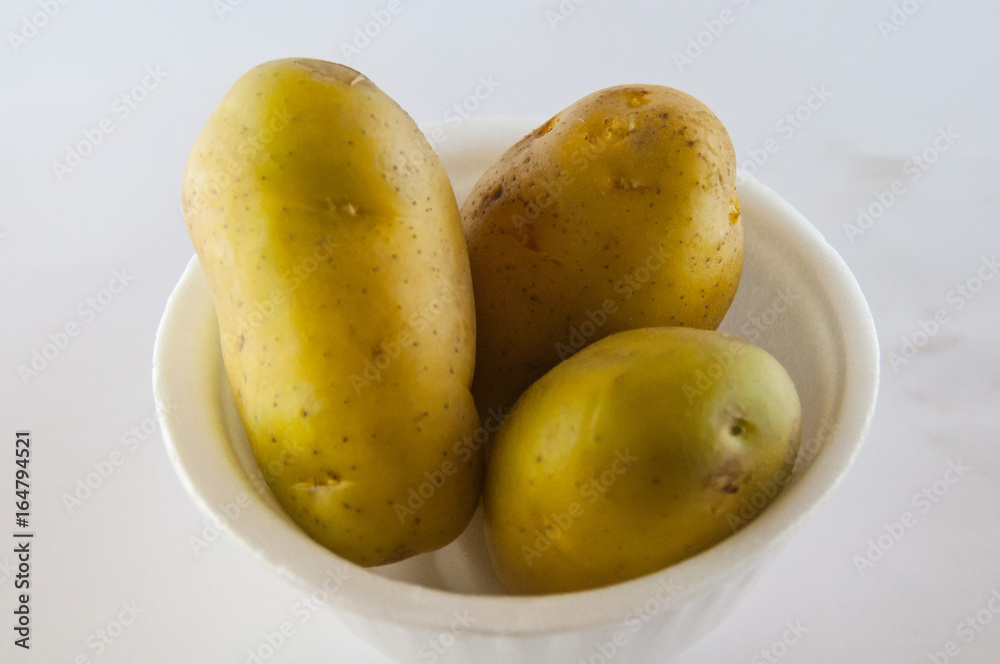 New potato isolated on white background close up New potato isolated on white background close up