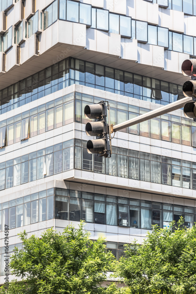 traffic light front of modern business architecture in Shanghai,China.