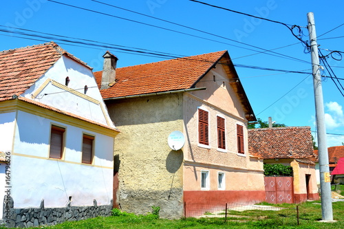 Typical rural landscape in the village Ungra, transylvania. Peasants houses. photo