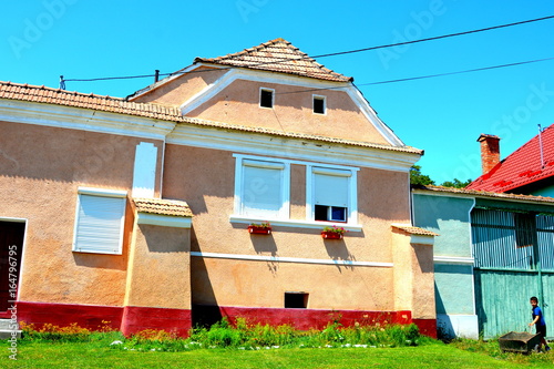 Typical rural landscape in the village Ungra, transylvania. Peasants houses. photo