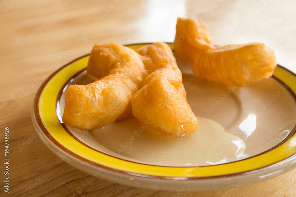 Deep-Fried Dough Stick (Patongko) on the cute plate Deep-Fried Dough Stick (Patongko) on the cute plate