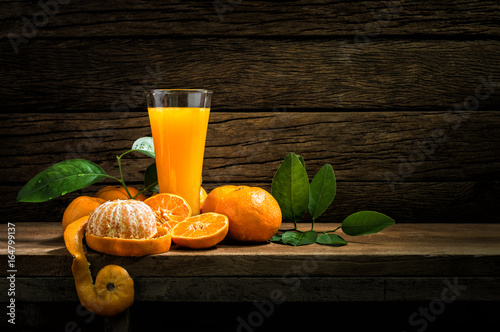 Still Life Glass of Fresh Orange Juice on Vintage Wood Table with Copy Space Background