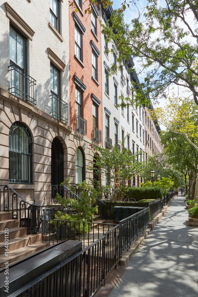 Townhouse buildings in Chelsea, New York in a sunny day