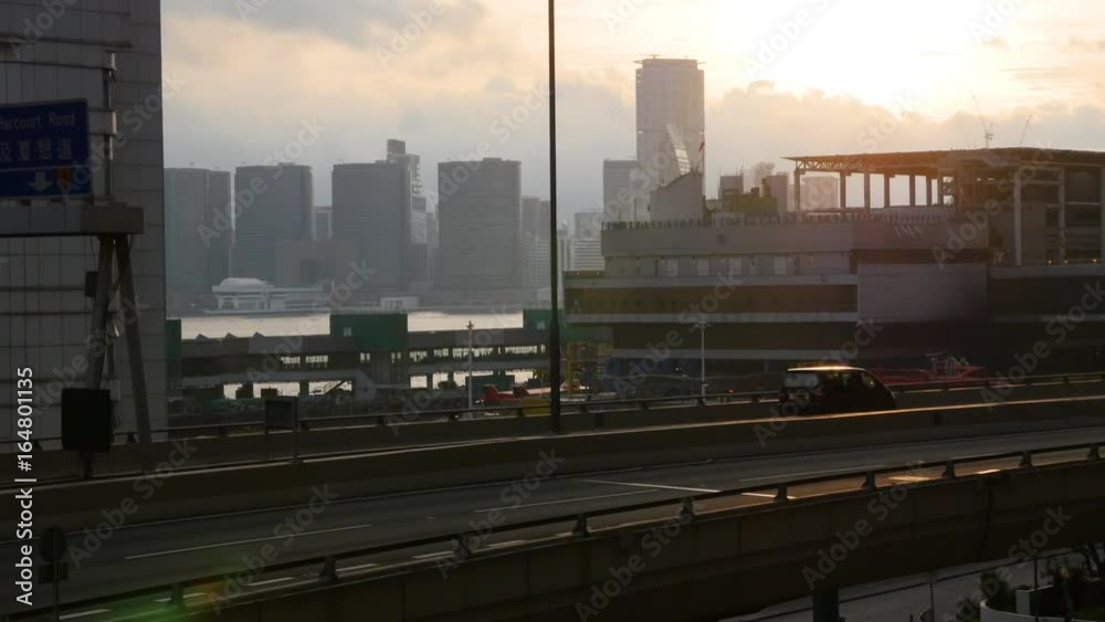 An idyllic scenic shot of the sun setting. The shot is taken in the middle of an urban city in Hong Kong. An idyllic scenic shot of the sun setting. The shot is taken in the middle of an urban city in Hong Kong.