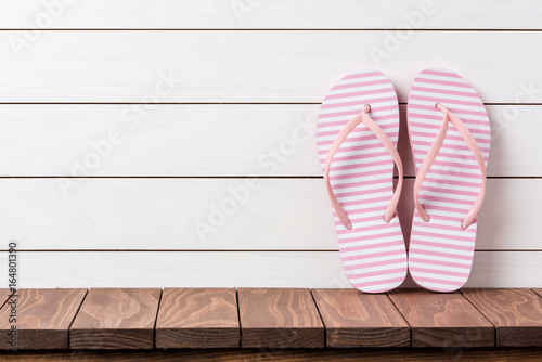 Flip flops on wooden background