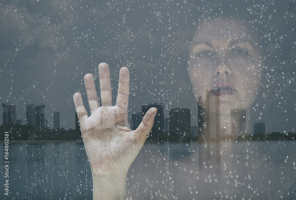 Double exposure of the female hand and face and the city of Malaysia Double exposure of the female hand and face and the city of Malaysia