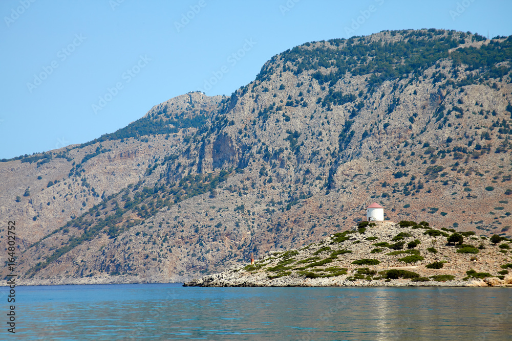 Fototapeta premium lighthouse on small island greece