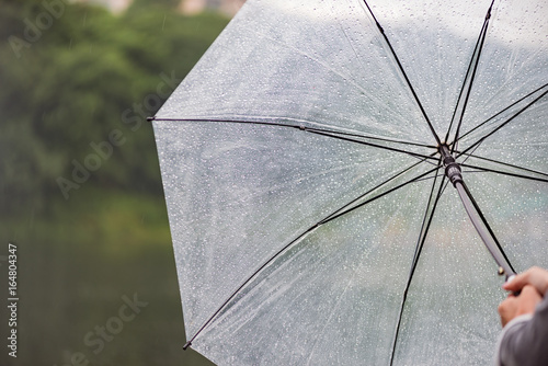 Girl with an umbrella in heavy rain