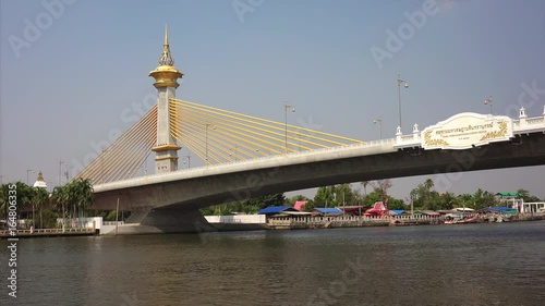 Maha Chesadabodindranusorn bridge spans the Chao Phraya River in Bangkok, Thailand  photo