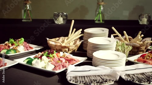 Plates with salami and cheeses