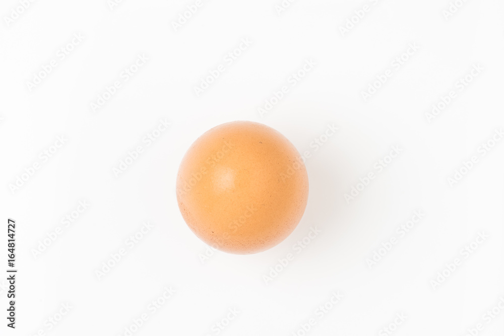 Single brown chicken egg on white background Single brown chicken egg on white background