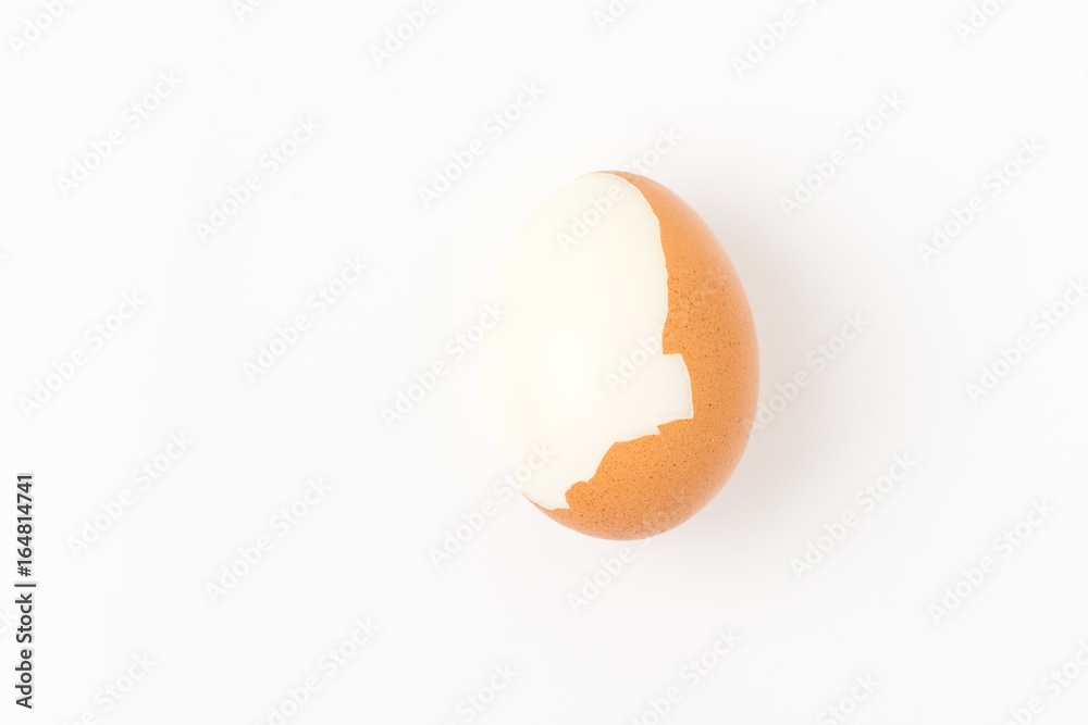 Single brown chicken egg on white background Single brown chicken egg on white background