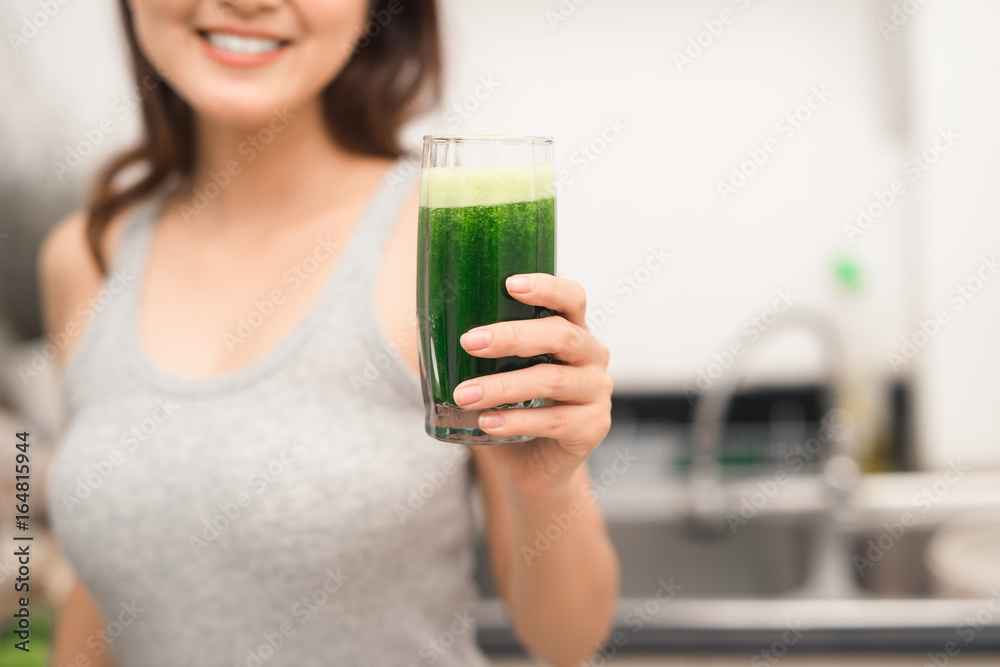 Young asian woman enjoy healthy vegetarian smoothie for weight loss and detox Young asian woman enjoy healthy vegetarian smoothie for weight loss and detox