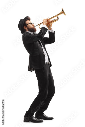 Musician playing a trumpet photo