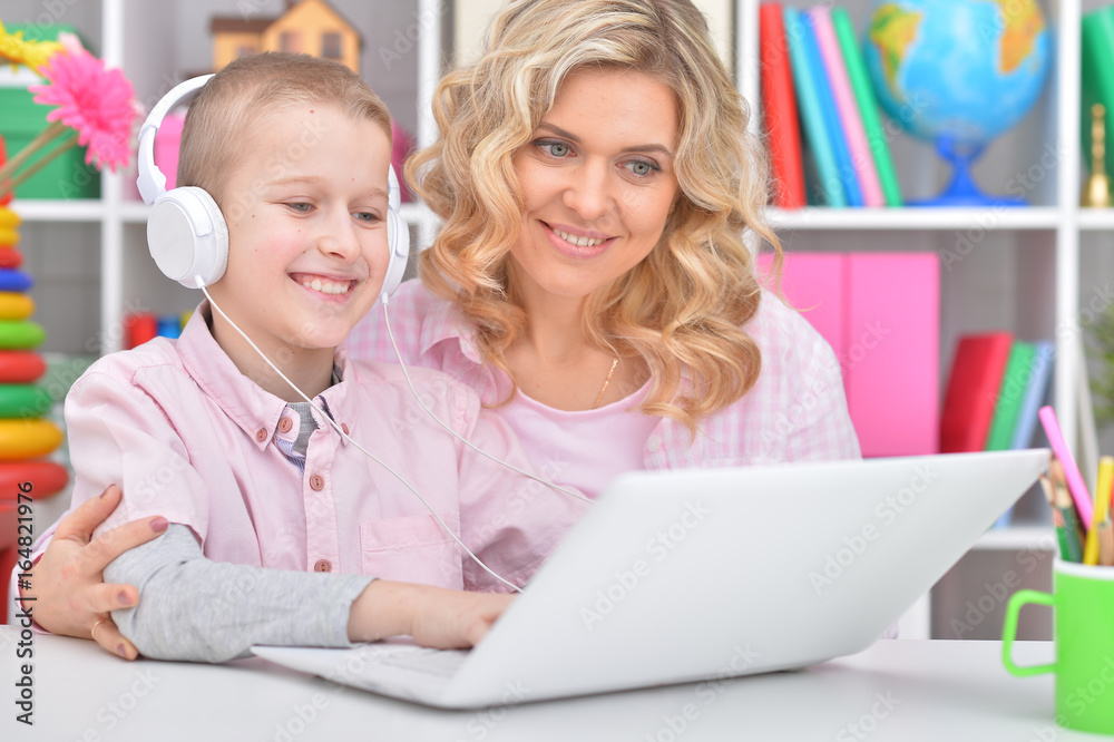Mother and son using laptop Mother and son using laptop