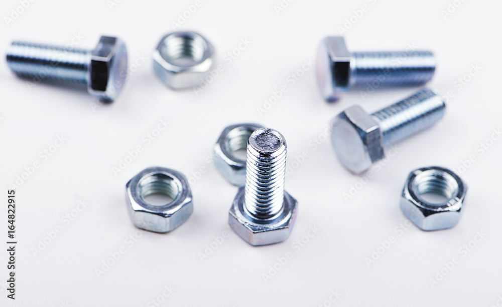 Nuts and bolts on white background. Isolated. Nuts and bolts on white background. Isolated.